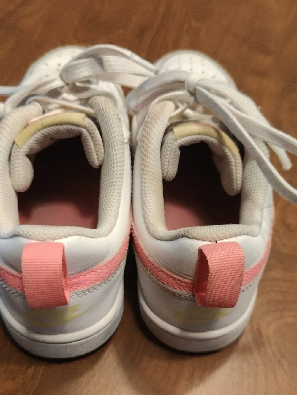 Nike White Low-Top Sneakers with Pink Swoosh